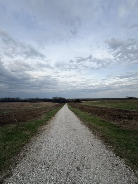 Cleared gravel road through reshaped farmland banks, Northeast Missouri — Emanuel Excavation