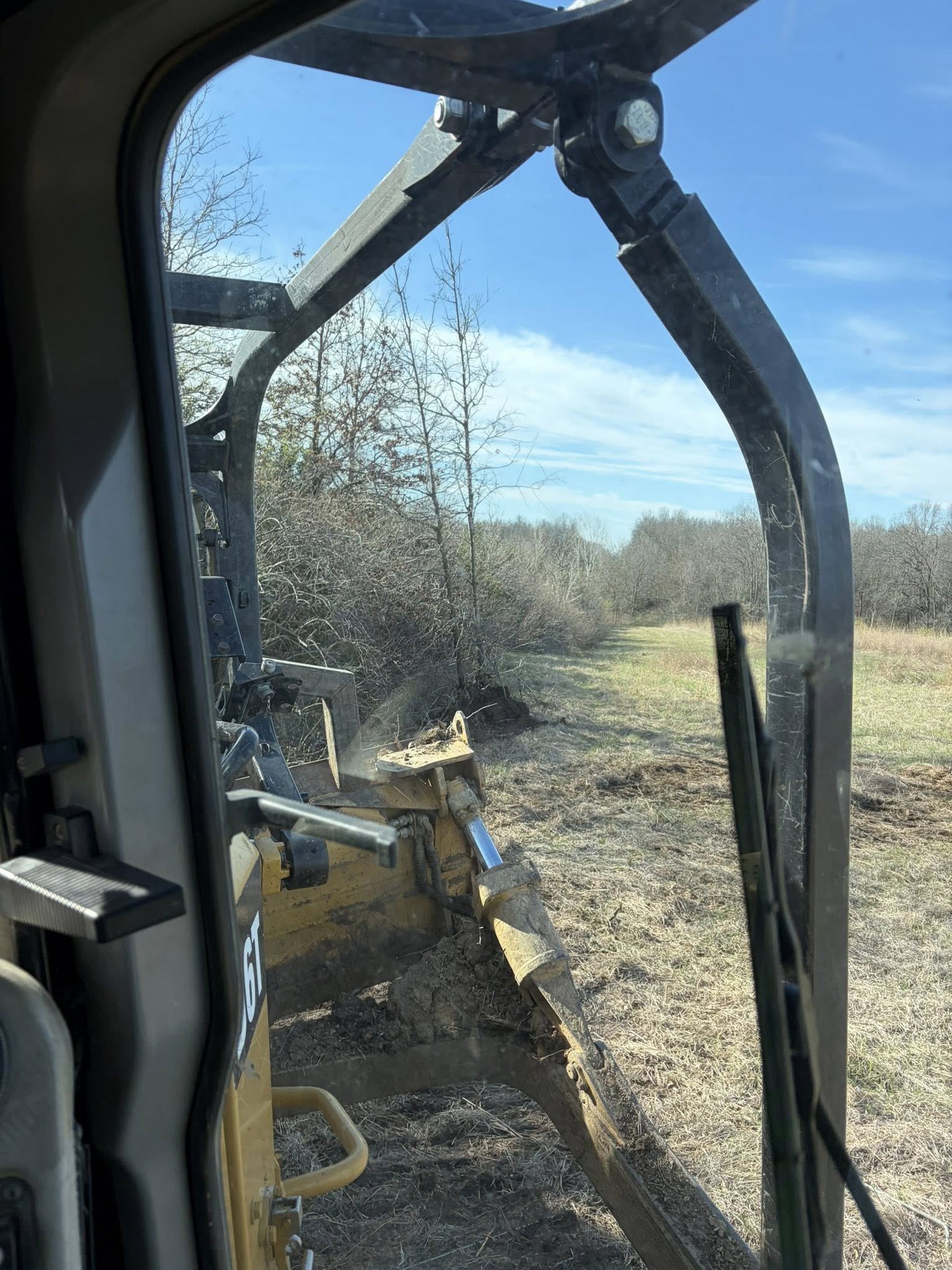 Overgrown road banks before clearing — Emanuel Excavation, Macon Missouri